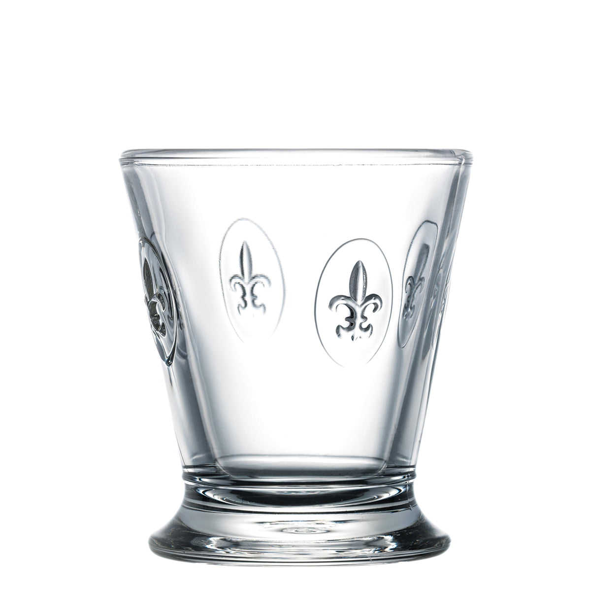 Front view of Fleur de Lys glass tumbler showcasing embossed fleur-de-lys medallions and weighted skirted base on white background