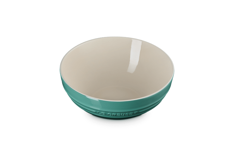 Three-quarter view of Multi Bowl, 3.1 qt. in Artichaut showcasing its cream interior and vibrant glaze on an isolated background