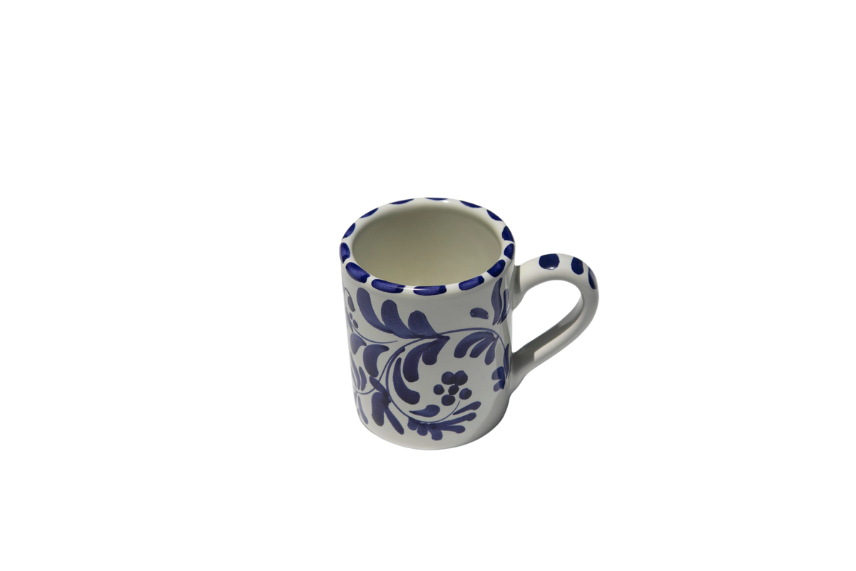 Front view of Americano Mug in Azul Classico showcasing blue swirling leafy impressions with a black background