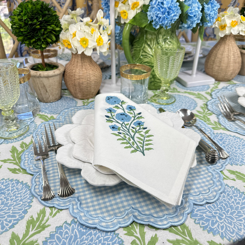 Blue flower motif napkin on blue gingham placemat 