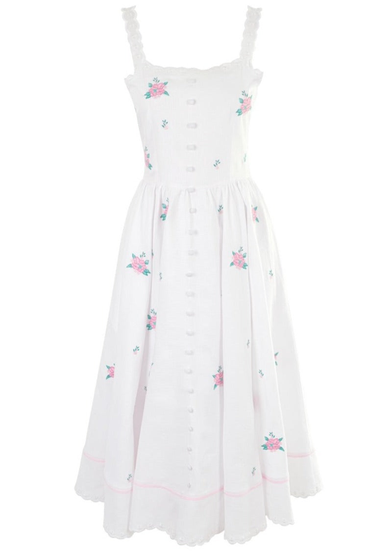 Front view of OTM Exclusive: Cathleen Dress showcasing floral embroidery, button front, scalloped straps and hem against a white background