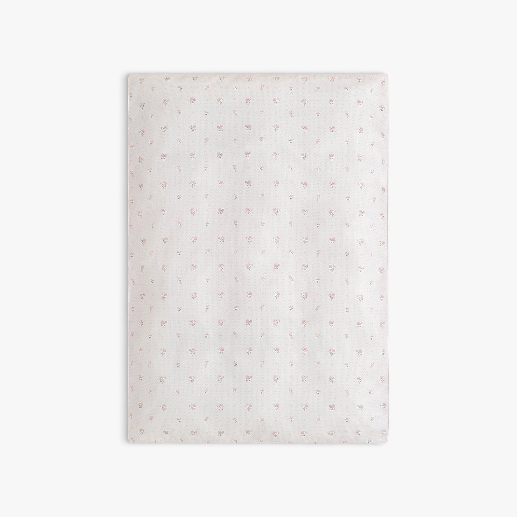 Baby duvet in Ditsy Floral in Pink, laid flat. 