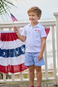 Little English traditional children's clothing.  Blue gingham shorts with all-over American flag embroidery for boys.  Boy's shorts for 4th of July.
