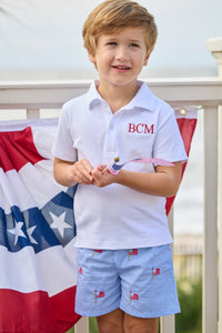 Little English traditional children's clothing.  Blue gingham shorts with all-over American flag embroidery for boys.  Boy's shorts for 4th of July.