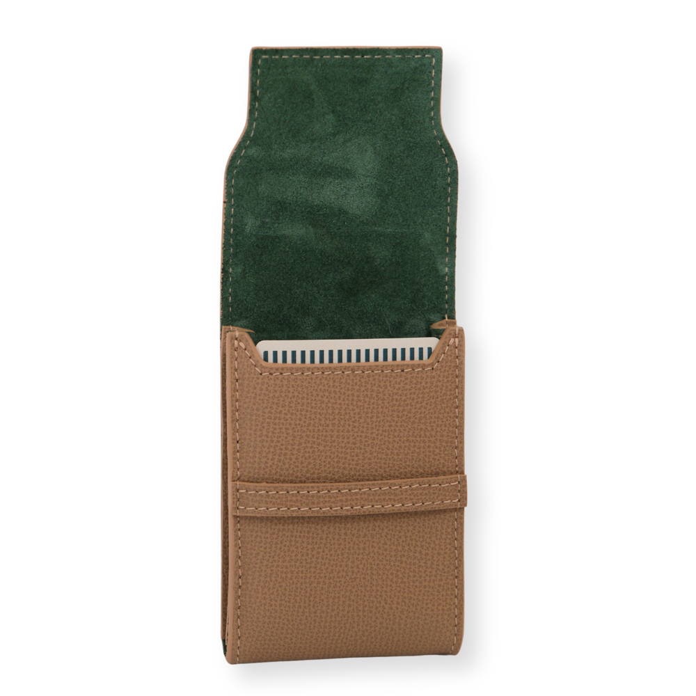 Front view of Palmilla leather playing card case open to show tan pebbled Italian leather exterior and green suede lining with a striped card deck on white background