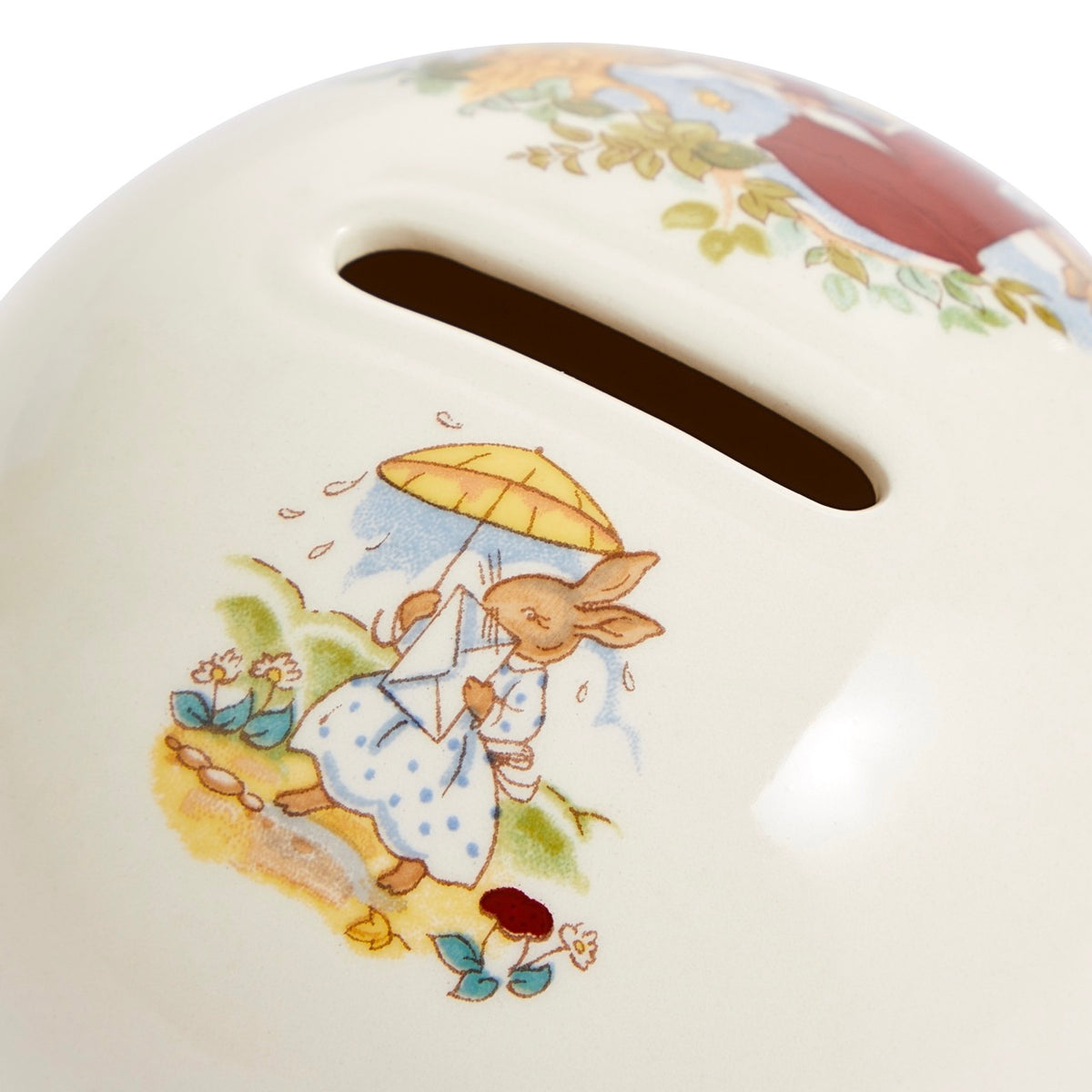 Close-up top view of Bunnykins Money Ball Bank showcasing the coin slot and Bunnykins rabbit illustration on cream bone china