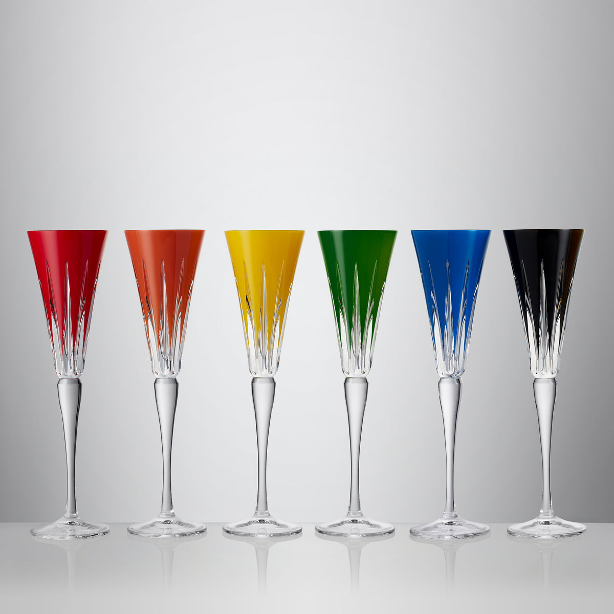 Front view of New Year Flutes Firework Mixed, Set of 6 showcasing bold linear cuts and six opaque colors on a light gray background