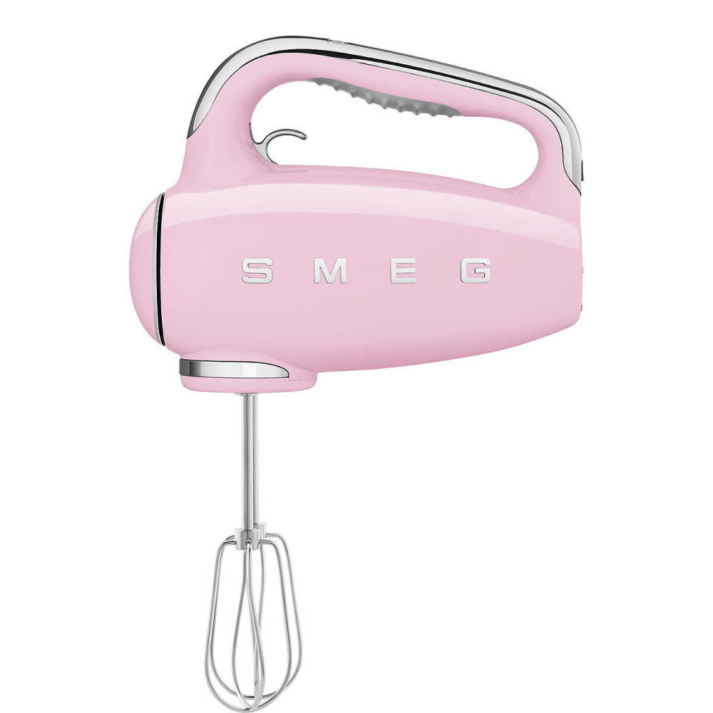 Side view of pink SMEG Hand Mixer showcasing attached wire whisks with a white background