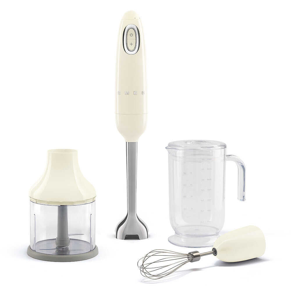 Front view of SMEG hand blender with cream motor base, chopper, beaker, and wire whisk on white background