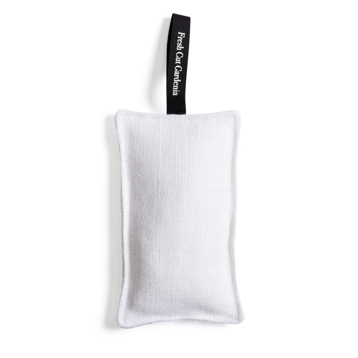 Top-down view of Fresh Cut Gardenia scented sachet showcasing white rectangular cotton pouch with black hanging ribbon on white background