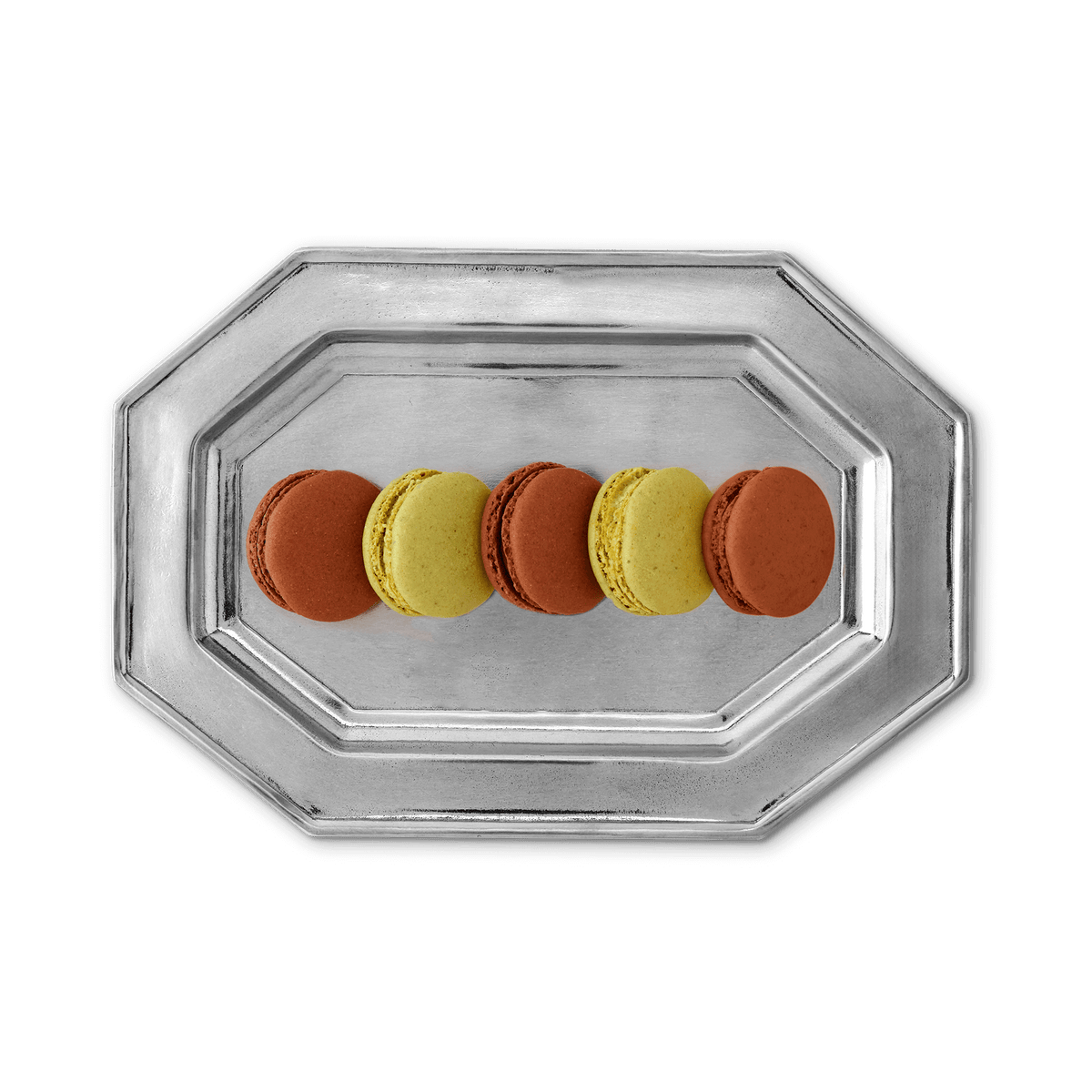 Top view of small octagonal pewter tray showcasing its raised stepped rim and luster with five macarons on a plain background