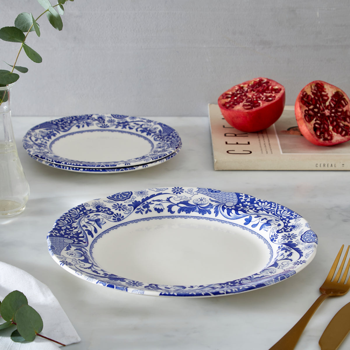 Close view of Brocato Dinner Plates, Set of 4 showcasing blue floral Brocato pattern with tabletop background