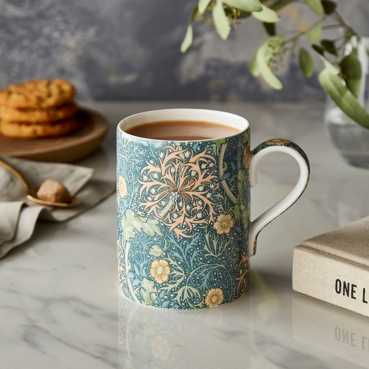 Front view of Morris & Co. Mug in Seaweed Seaglass, Set of 6 showcasing its floral Seaweed pattern with coffee on a marble table