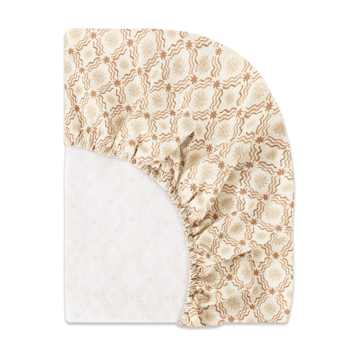 Folded view of All Stages Midi Crib Sheet in Autumn Star pattern with cream and tan details on white background