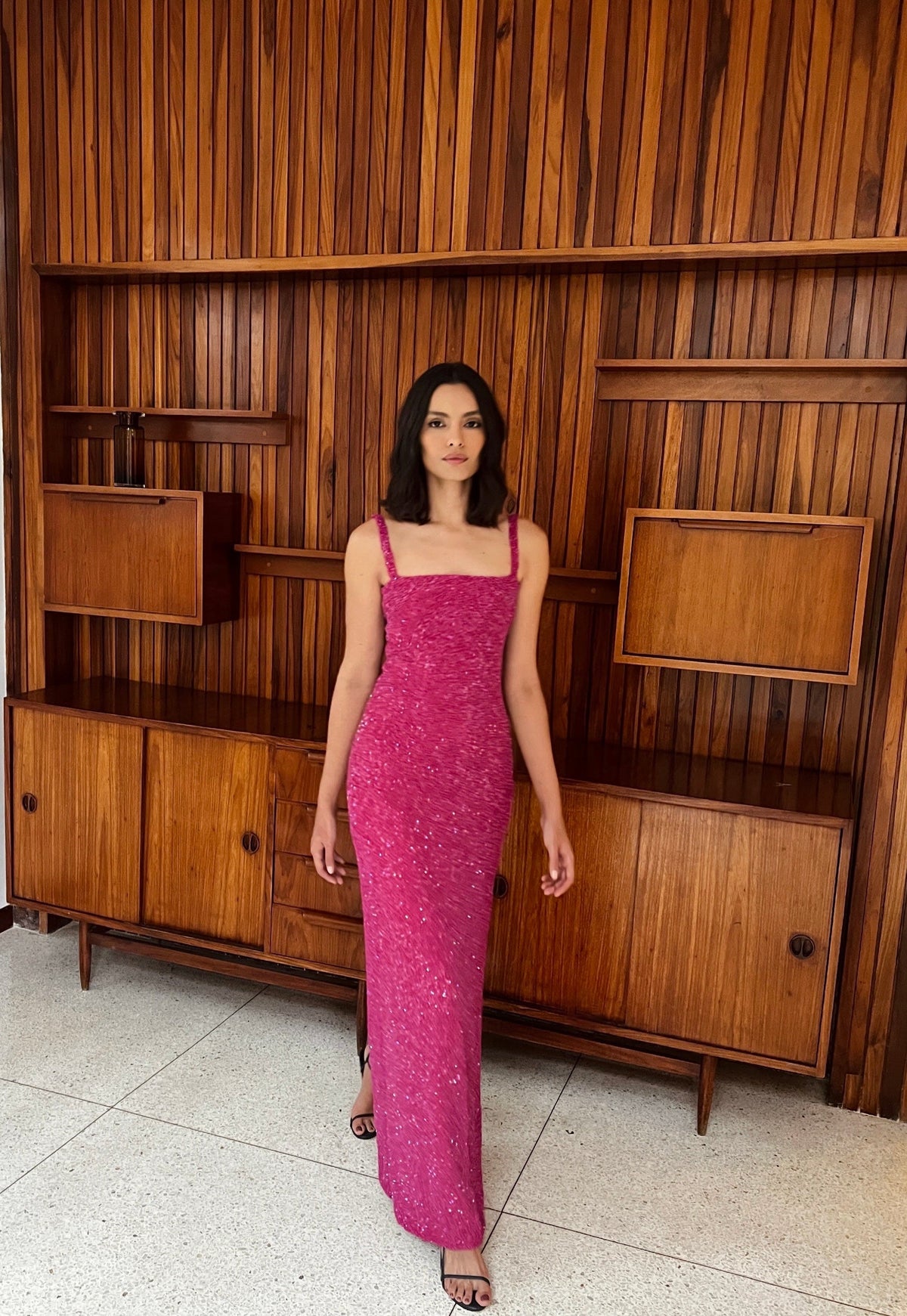 Front view of Luciernaga fuchsia dress with square neckline, thin straps and slim shimmering column silhouette