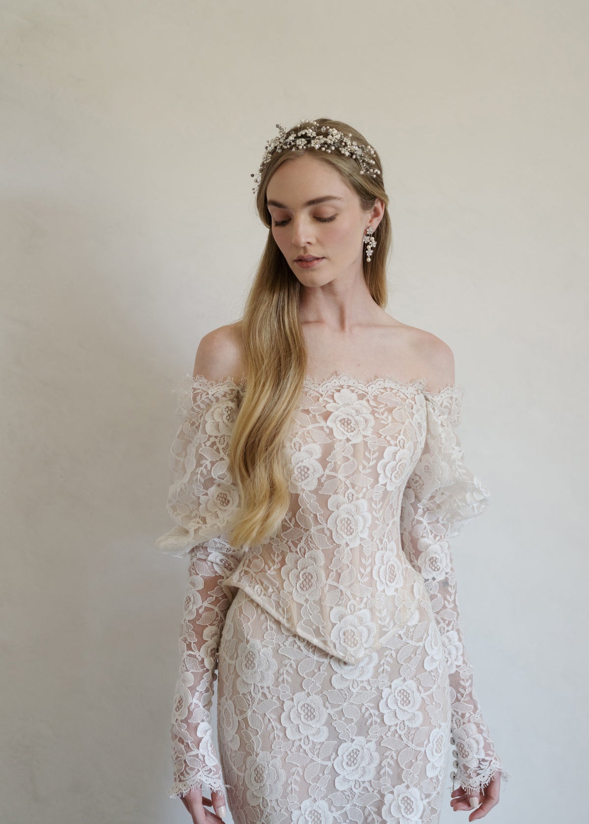 Front view of Nicola Comb in Crystal Pearl showcasing crystal and pearl floral details on a model against a neutral background