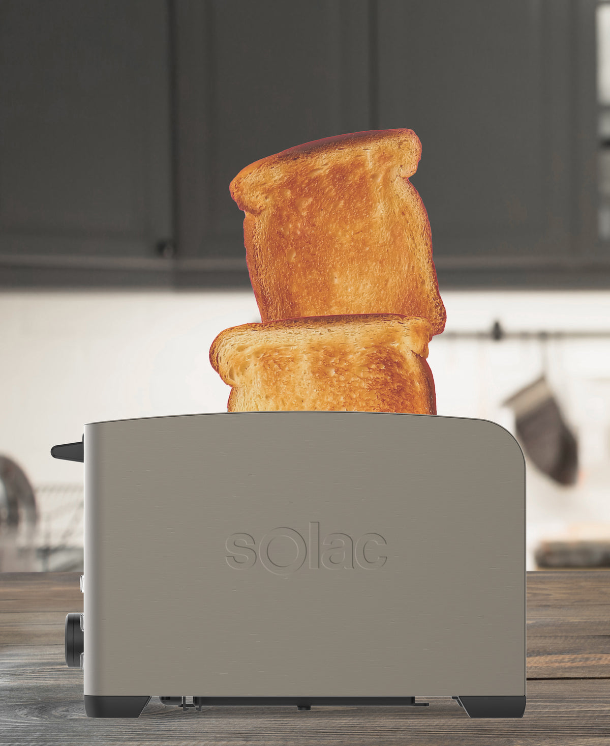 Front view of My Toast Ii Legend 2-Slice Toaster showcasing two slices of toast and dark brushed stainless-steel finish on a wooden counter