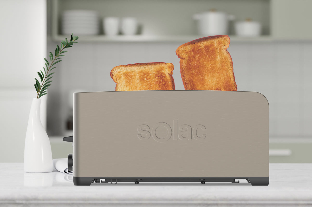 Front view of My Toast Duplo Legend 4-Slice Toaster showcasing toast in slots and dark brushed stainless-steel finish