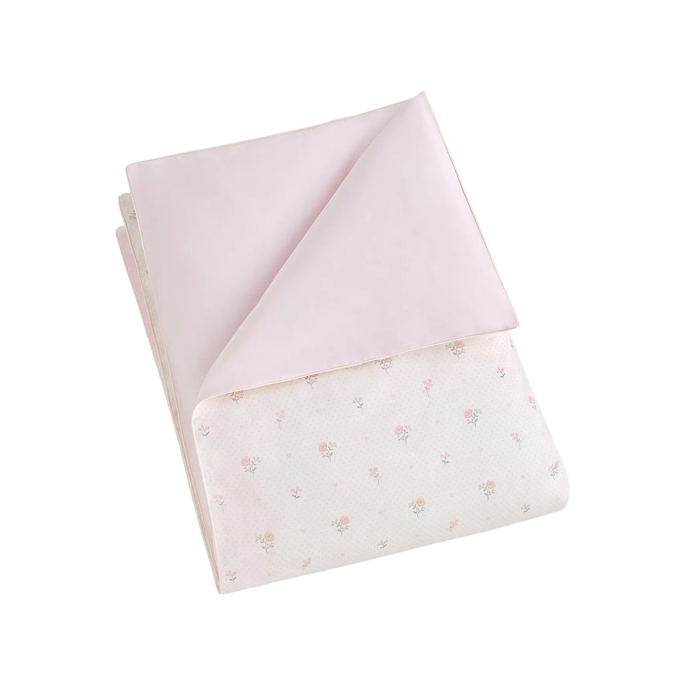 Child's duvet in Ditsy Floral in Pink, folded. 