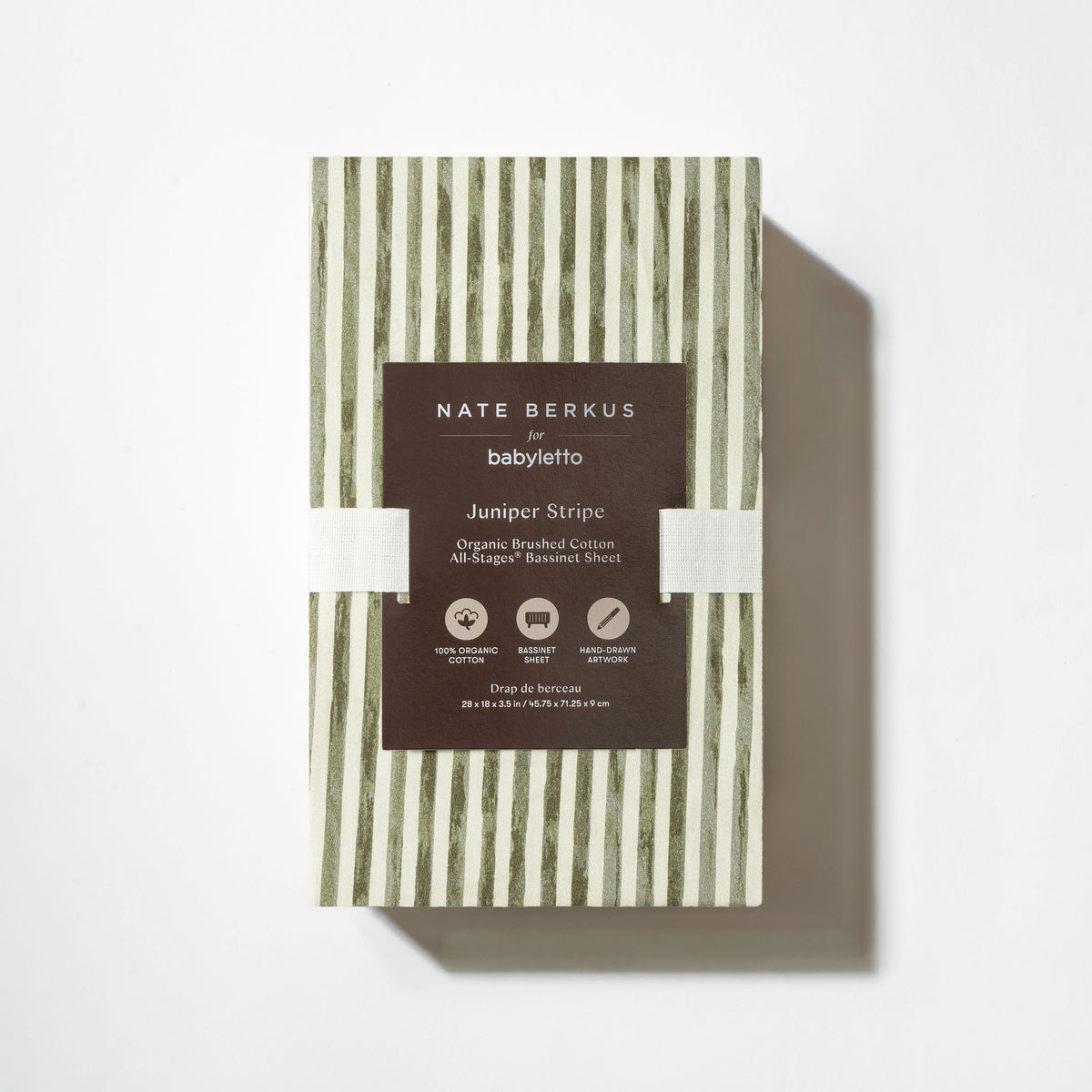 Front view of All-Stages Bassinet Sheet in Juniper Stripe showcasing green and white vertical stripes in white packaging