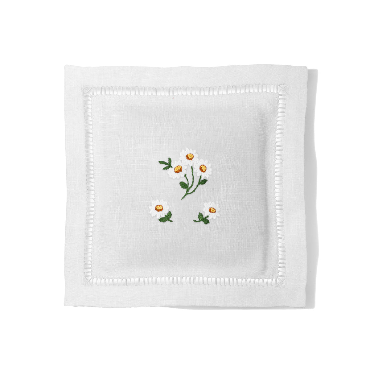 Top view of Daisies Scatter sachet showcasing hand-embroidered daisies and hemstitch on white linen, white background