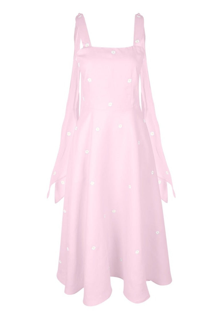 Front view of pink Shayna Dress showcasing white floral embroidery and adjustable tie straps against a white background