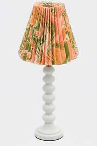 Table lamp with hand-marbled pleated empire lampshade in peony bloom pattern on white base