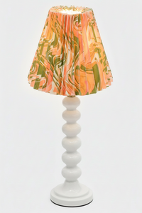 Table lamp with hand-marbled pleated empire lampshade in peony bloom pattern on white base
