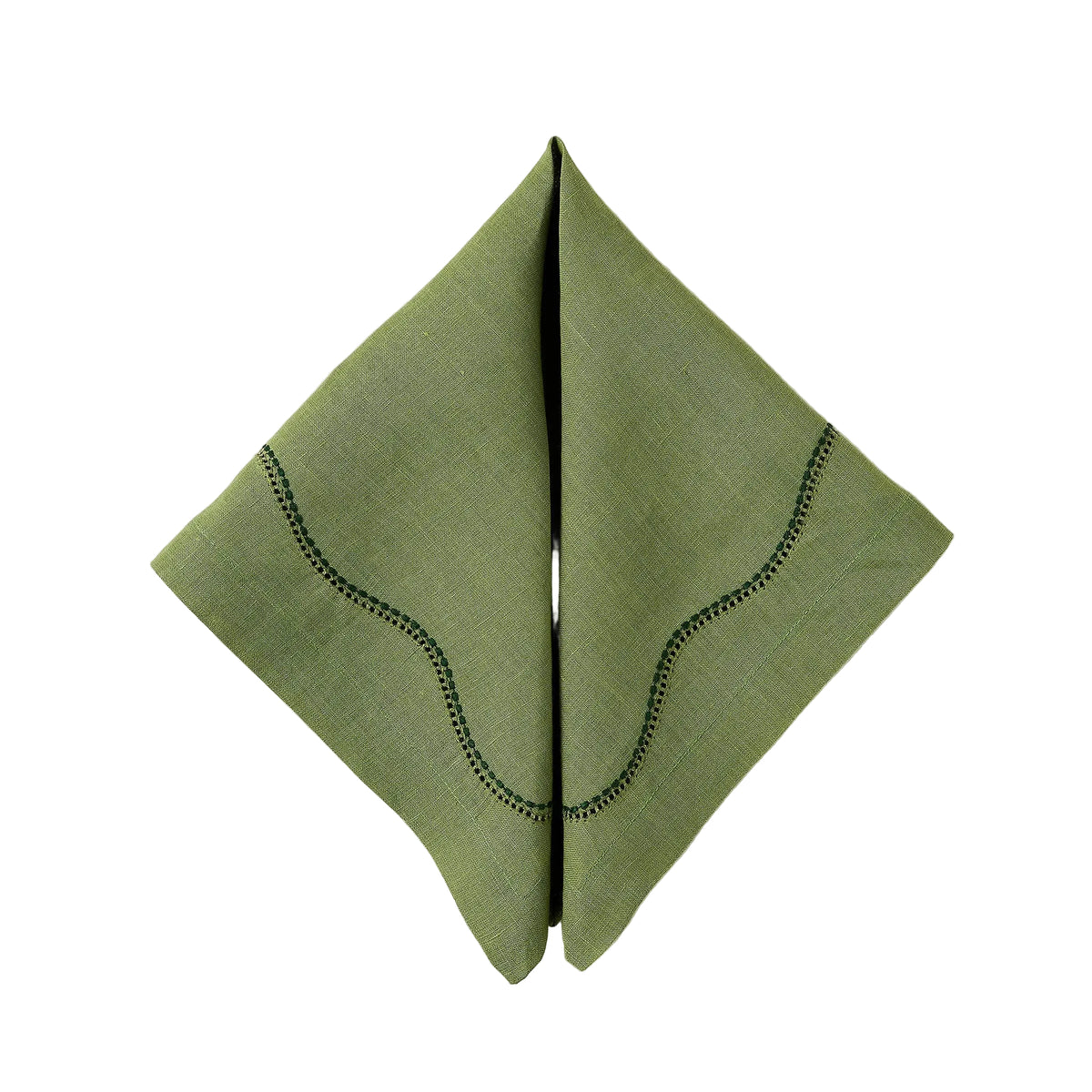 Folded view of Le Chemin Napkin in Moss showcasing curved artisanal detailing on green linen with a white background