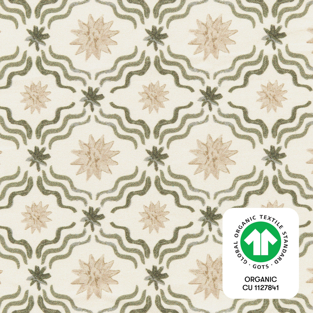 Close-up of the Juniper Star mini crib sheet showcasing wavy lines and star motifs with a GOTS certification badge