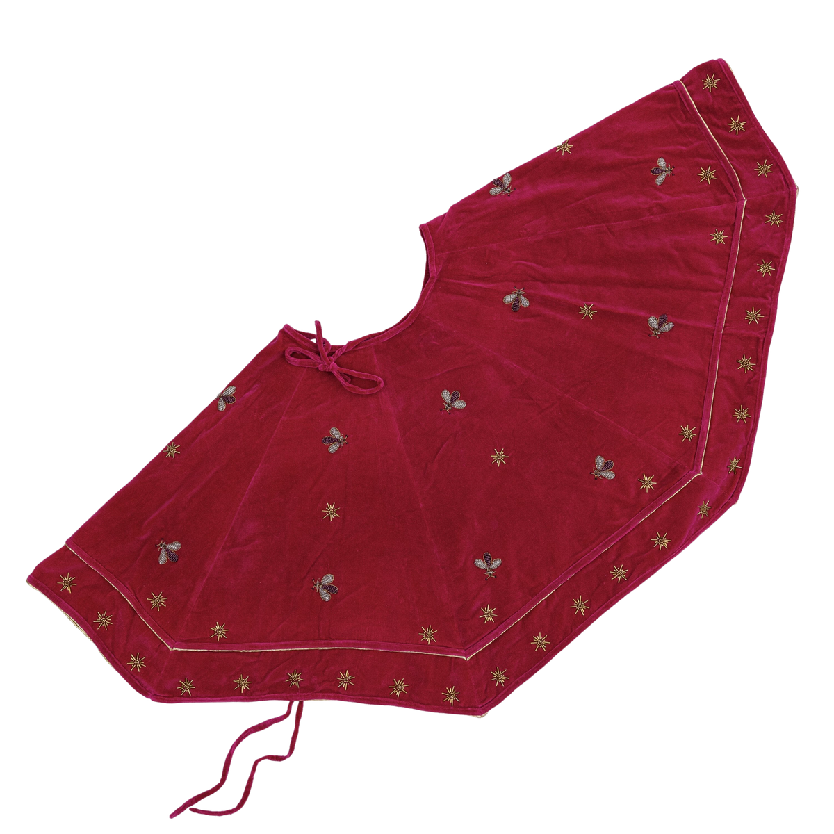 Angled view of Sparkle Bee Tree Skirt in Berry showcasing hand-embroidered bee and star embellishments on cotton velvet