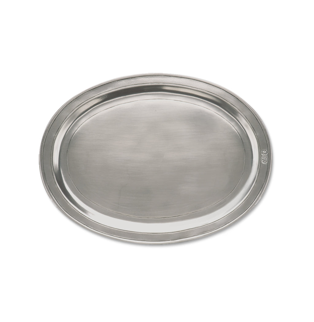 Top view of Oval Incised Tray, Medium showcasing its raised oval rim on a white background