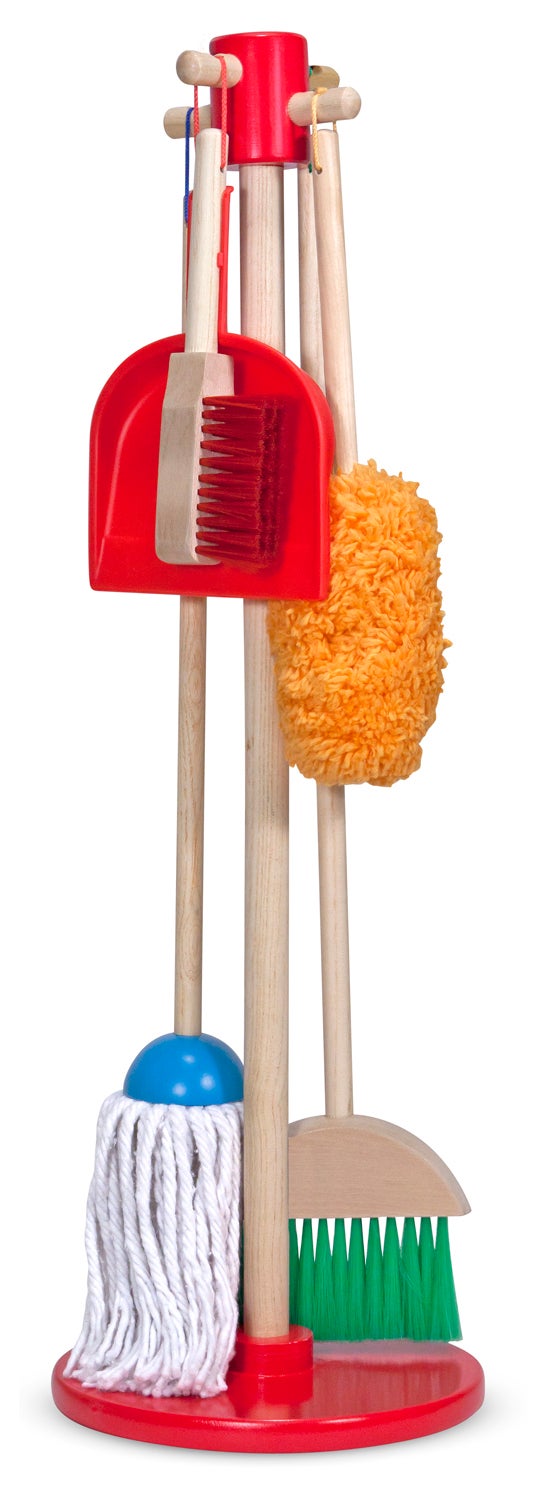 Front view of Let’s Play House dust sweep and mop set showcasing six wooden-handled tools (broom, mop, duster, dustpan, hand brush) hanging on a red stand against a white background