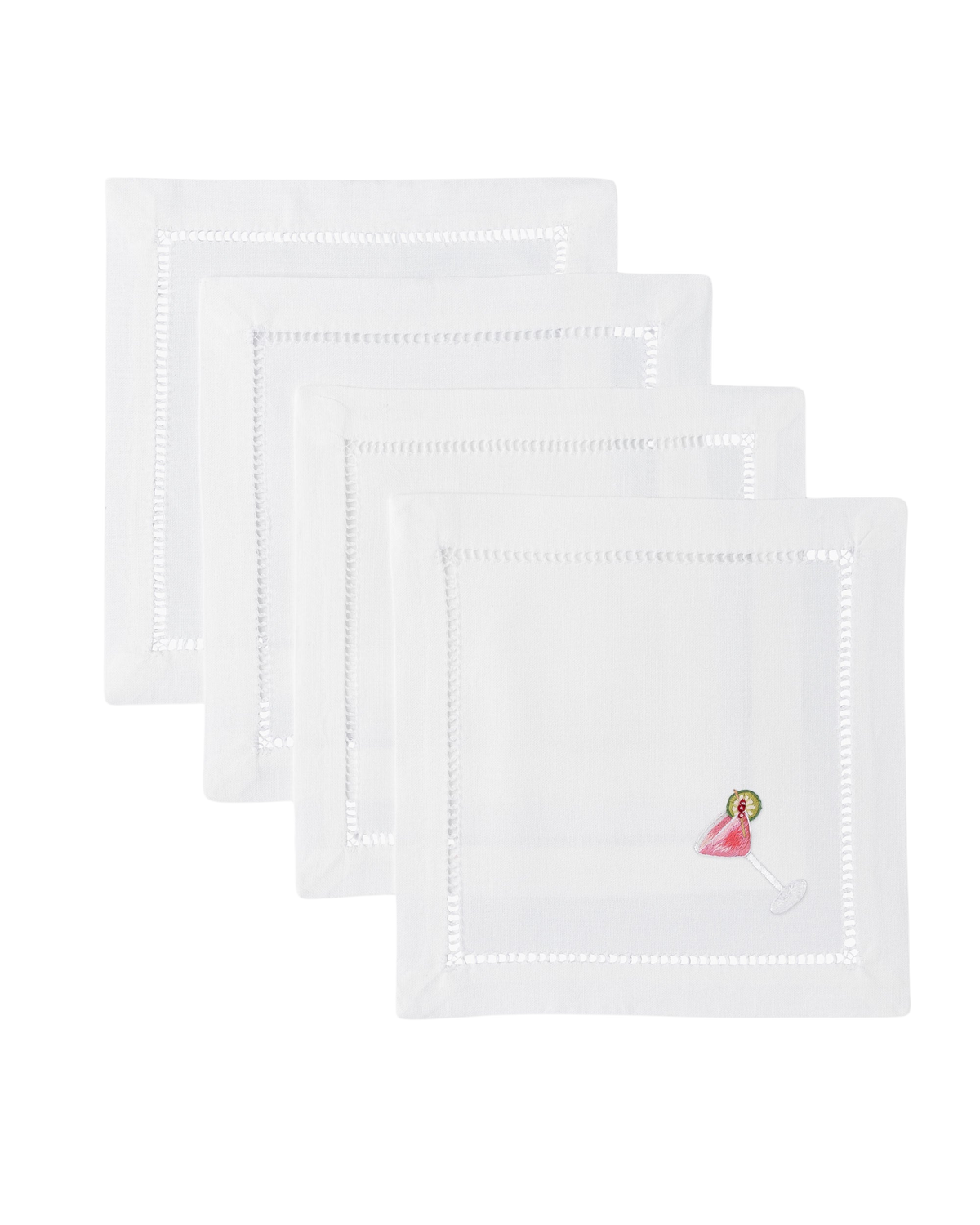 Flat lay of Cosmo cocktail napkins set of 4 showcasing hand-embroidered pink cocktail glass and hemstitched edges on white background