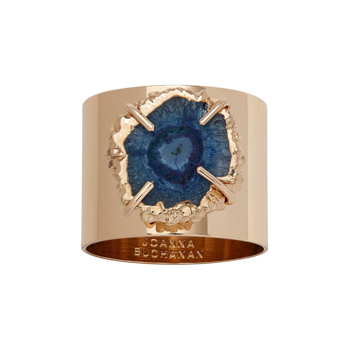 Close-up of an indigo crystal quartz napkin ring showcasing shiny gold electroplated edges against a black background