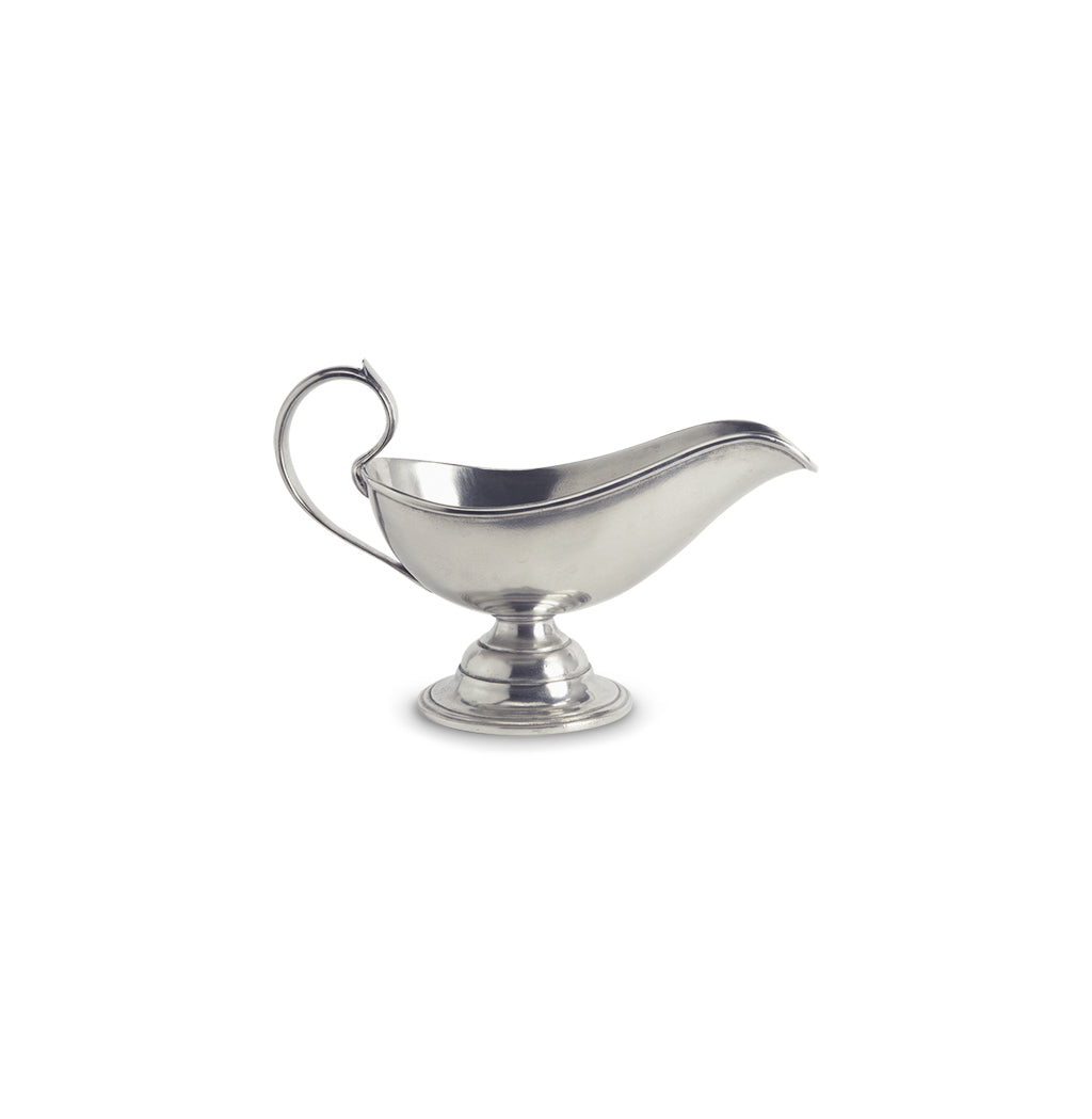 Side view of Match pewter Gravy Boat showcasing curved spout and loop handle with white background