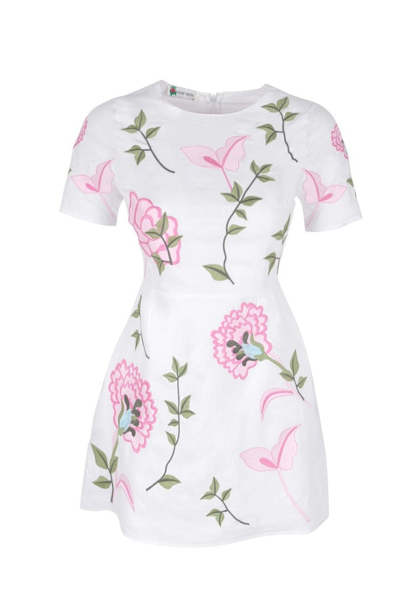 Front view of OTM Exclusive Grace Dress showcasing pink and green floral embroidery on white fabric with a plain white background