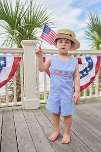 Little English traditional children's clothing.  Classic john john for toddler boys in royal blue mini gingham with American flag smocking at the chest