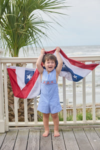 Little English traditional children's clothing.  Classic john john for toddler boys in royal blue mini gingham with American flag smocking at the chest