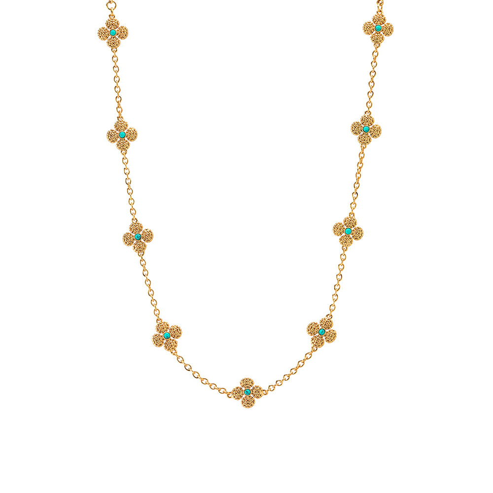 Front view of Berry Clover double sided 16 inch necklace showcasing gold chain with turquoise-centered clover stations on white background