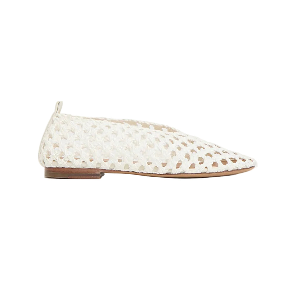 Side view of Woven Ballerina flat in white showcasing woven leather upper, pointed toe, and low stacked sole on white background
