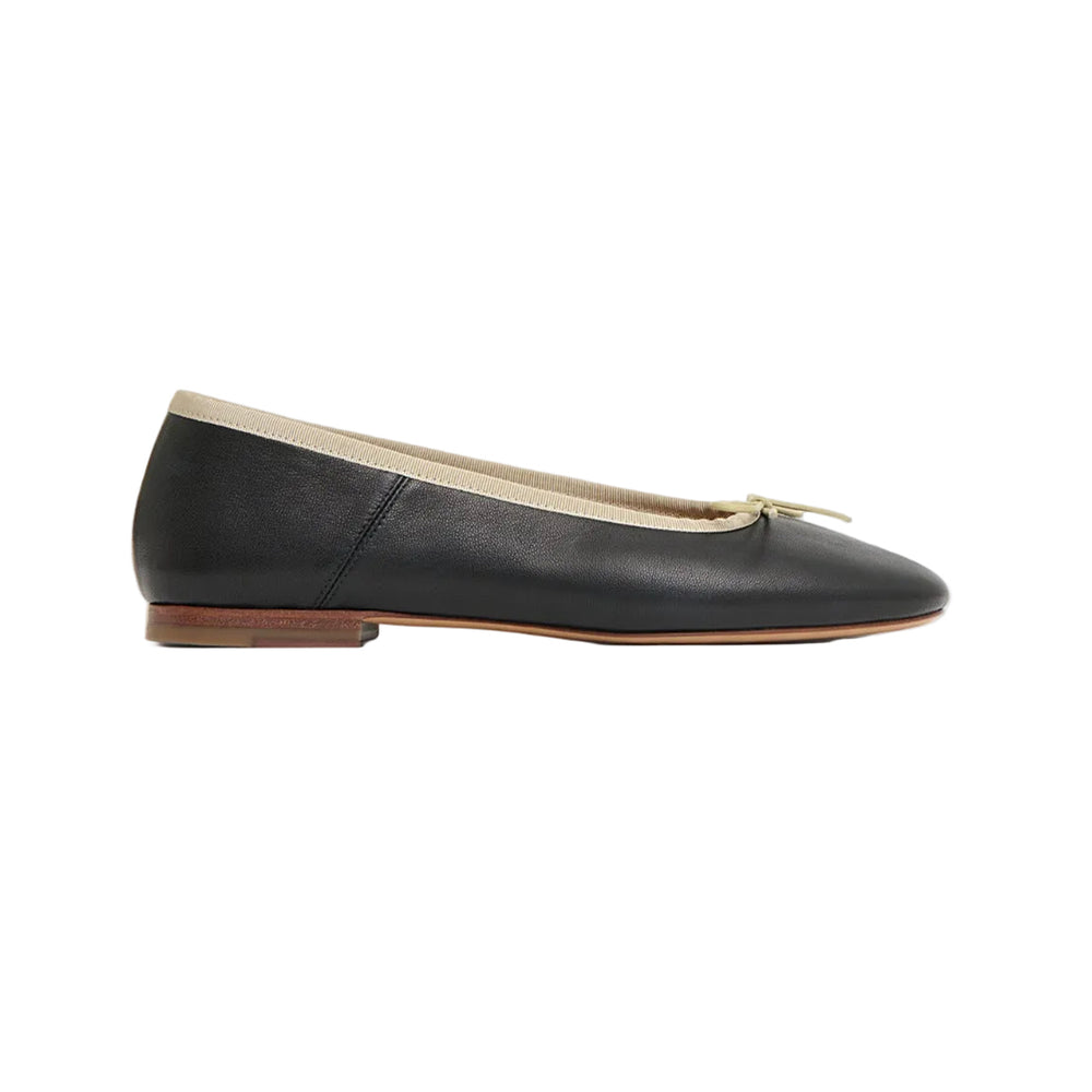 Side view of Dance Ballerina flat in black leather with crema trim, small bow, and low stacked heel on white background