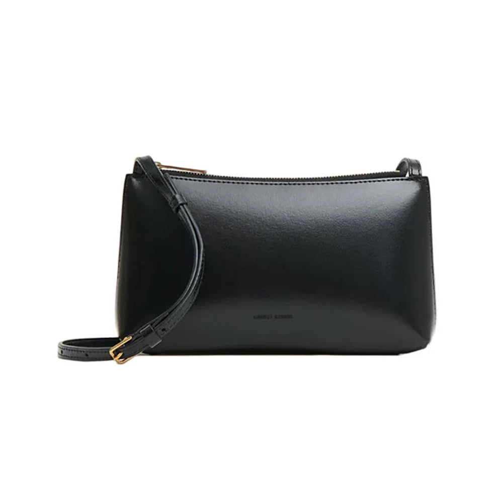 Front view of Mini Gaia Crossbody showcasing glossy black Spazzolato leather, zip-top closure and slim adjustable strap on white background