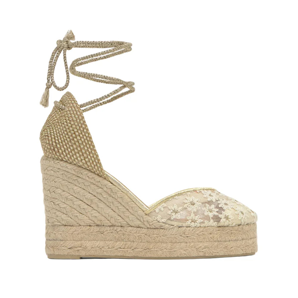 Side view of Claire 8ED wedge espadrille with white-and-gold embroidered lace upper, ankle wrap ties and braided jute platform