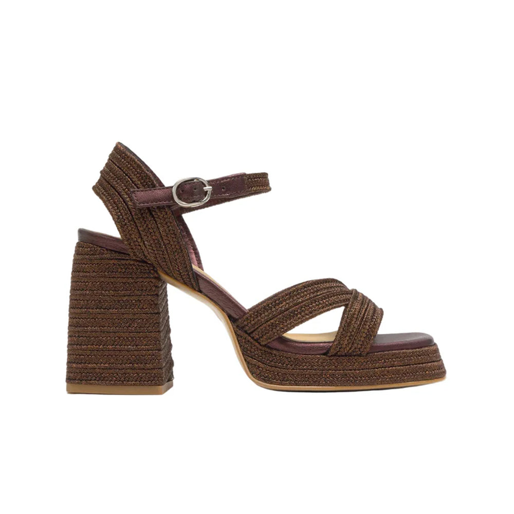 Side view of Valle sandal in dark brown with braided straps, ankle buckle, cushioned platform and block heel on white