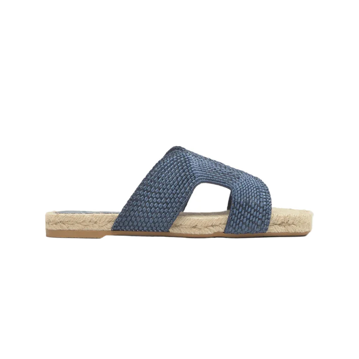 Side view of Pura flat sandal in Denim Blue showcasing woven rayon and linen upper, jute midsole and rubber sole on white background