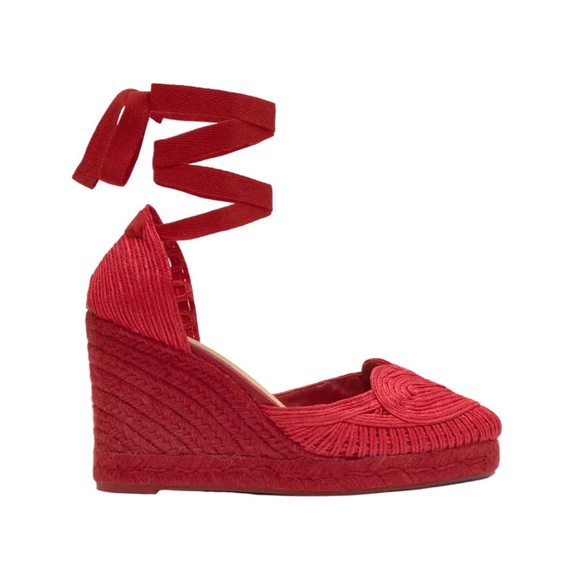 Side view of Cacia espadrille showcasing red braided upper, jute wedge and wraparound ankle ties on white background