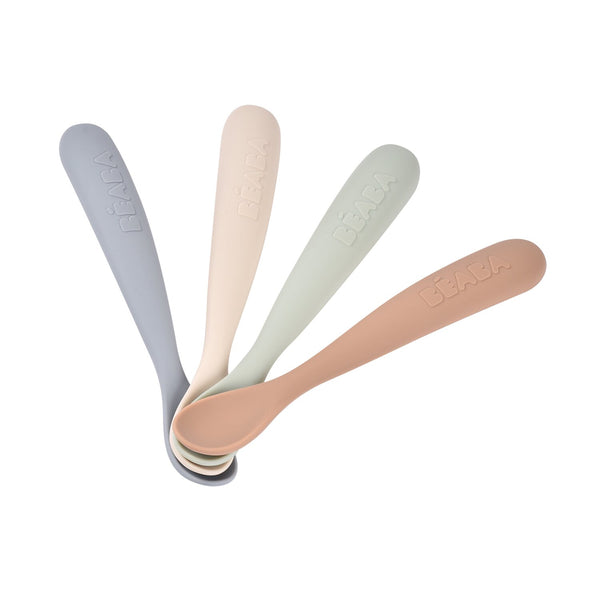 Angled view of four Natural First Stage Single Tone Silicone Spoons with flexible tips and long handles