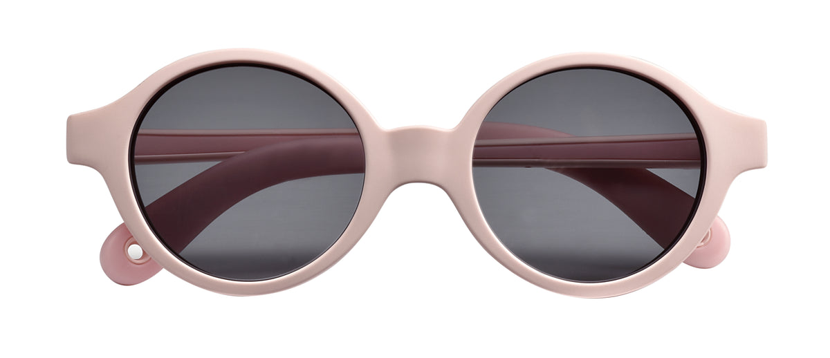 Front view of Joy Infant Sunglasses in Pink showcasing round dark lenses and side shells with a white background
