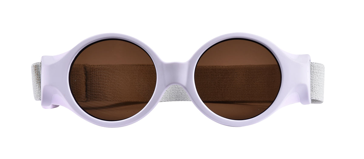 Front view of Glee Infant Sunglasses in Lilac showcasing brown lenses, side shells, and elasticated headband on a white background